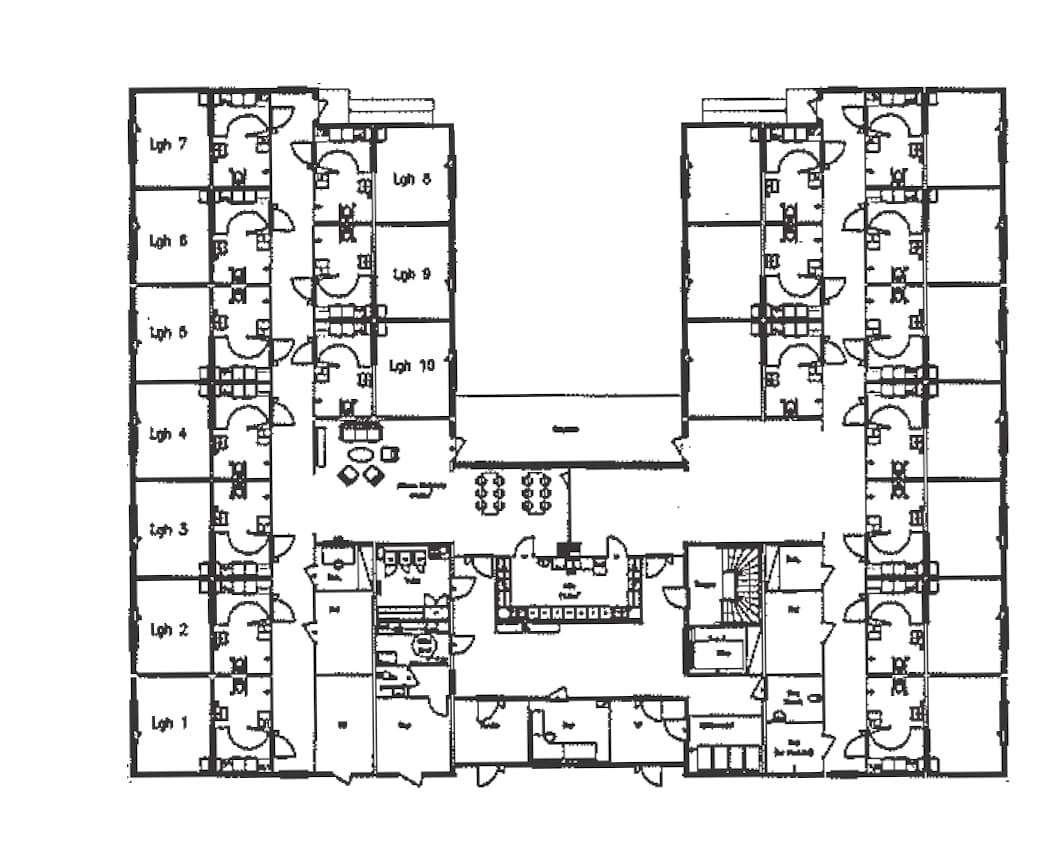 Original tre floor plan scan showing two wings of rooms around a central courtyard.